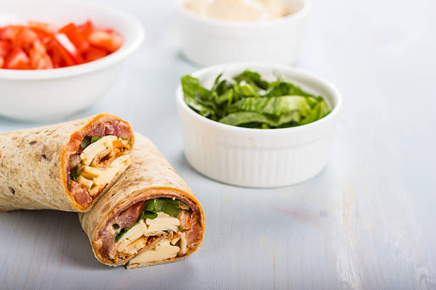 Wrap with tomato, lettuce, harissa and hoummous. stock photo