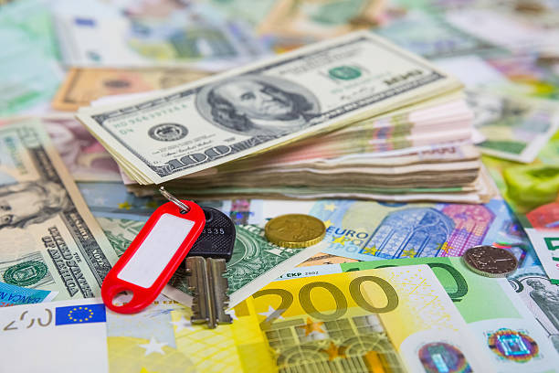 Key and a bundle of money stock photo