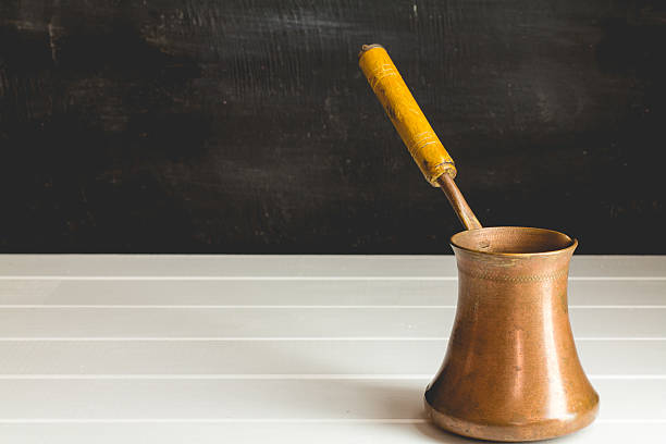 istock Coffee pot on a wooden background, horizontal 588602478