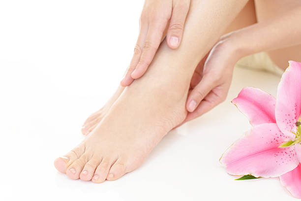 istock Woman's feet with flower 588605124