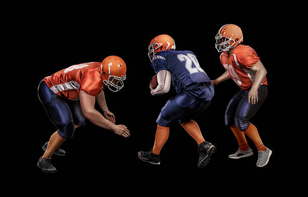 istock American football player running with ball during competitive game 588605412