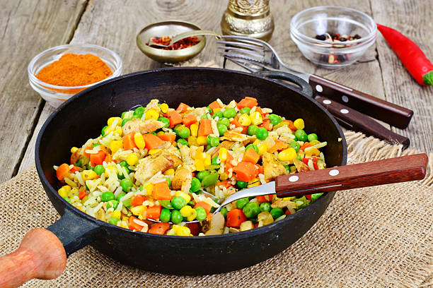 istock Risotto with Vegetables, Carrots, Peas and Chicken 588606672