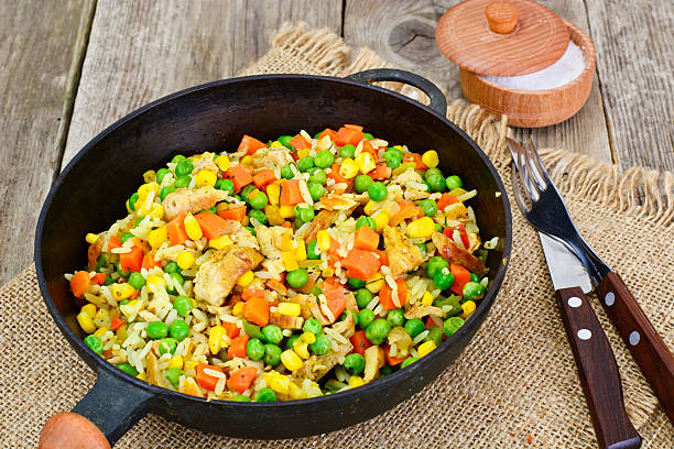 istock Risotto with Vegetables, Carrots, Peas and Chicken 588606706