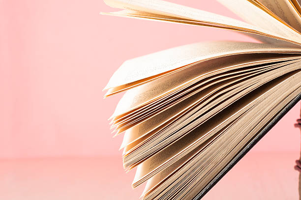 istock Open book, hardback books on wooden table. Education background. Back 588608030