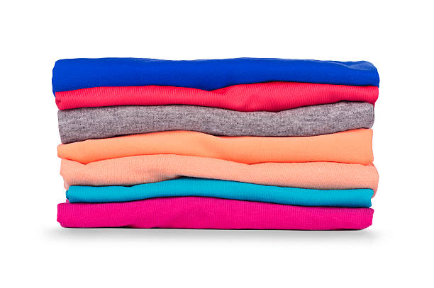 istock Pile of colorful clothes isolated on white background 588609016