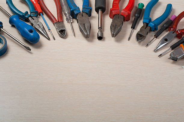 istock Set of electrical tool on wooden background. Accessories for engineering 588609130