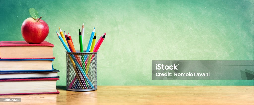 Back To School With Apple On Books And Colorful pencils Red Apple On Stack Of Books With Pencils And Blank Chalkboard Education Stock Photo