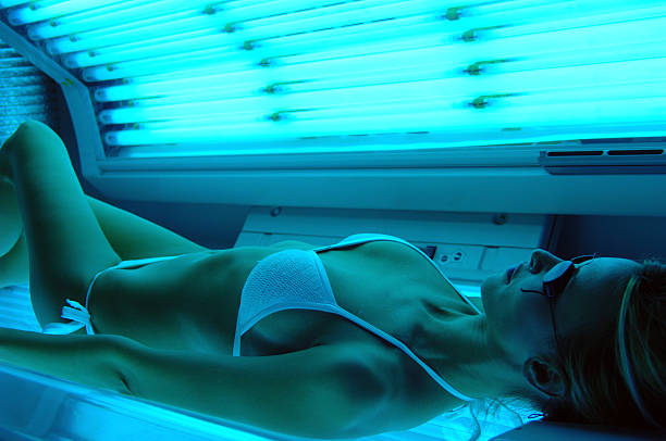 istock woman getting Solarium beauty treatment 588613338