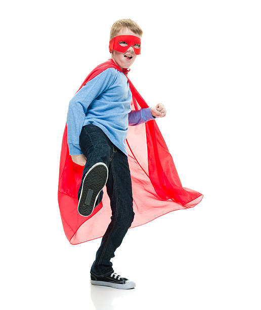 istock Smiling little superhero kicking 588613360