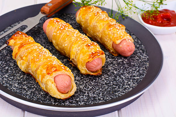 istock Grilled Sausage in Pastry with Sesame Seeds 588613440
