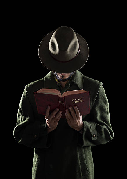 Close up on man reading a bookHe makes a surprised facial expression
