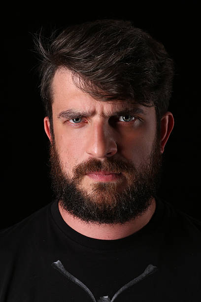 istock Bearded guy wearing shirt with serious look. Close.up. Black 588614366