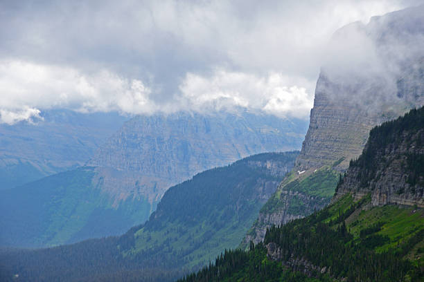 istock Fog hovers over mountains in Glacier National Park. 588616288