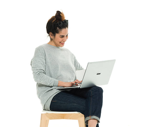 istock Cheerful woman working on laptop 588616674