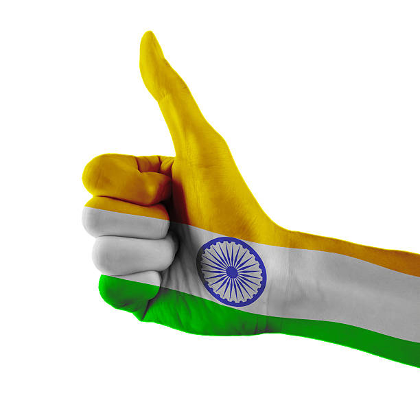 istock India flag painted hand showing thumbs up sign 588617790