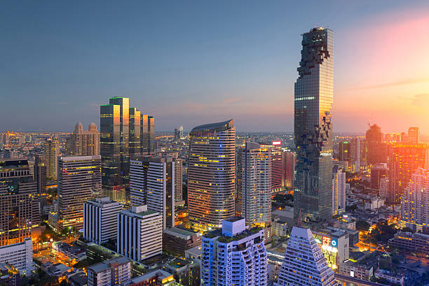 Aerial view of Bangkok modern office buildings, condominium Aerial view of Bangkok modern office buildings, condominium in Bangkok city downtown,Mahanakorn tower with sunset sky , Bangkok , Thailand bangkok stock pictures, royalty-free photos & images