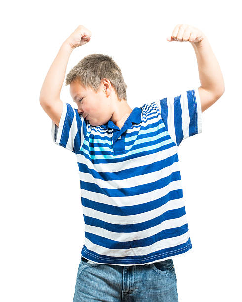 istock Preteen Boy Flexing His Muscles Showing Strength 588620814