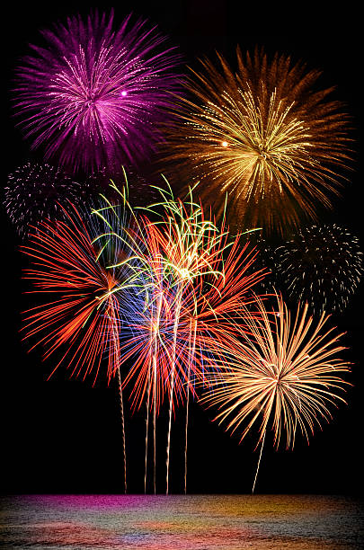 istock Colorful firework celebration on dark night sky background. 588621366