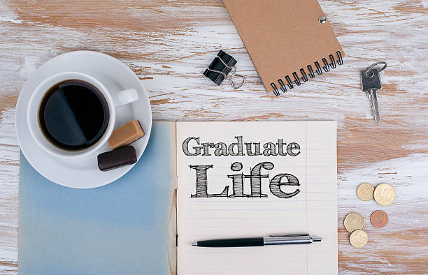 istock Graduate Life - Copybook on the desktop 588621646