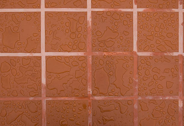 istock Drops of water on surface tiles 588953548
