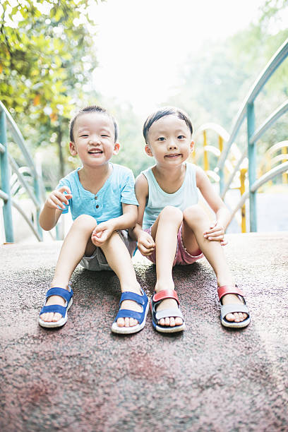 istock Cute children playing in the park 588953870