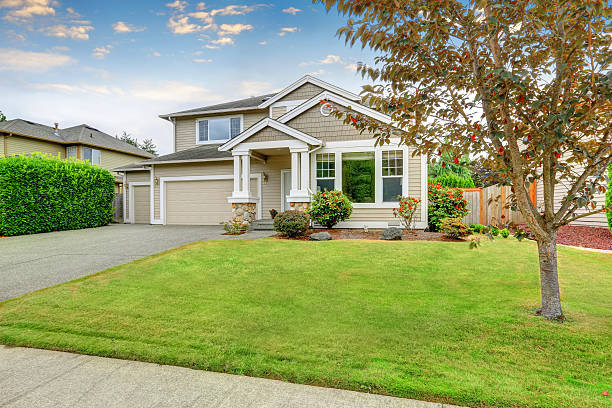 istock Neat beige home with two garage spaces. 588954686