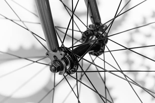 istock Bicycle spokes detail closeup. Black and white image. 588957004