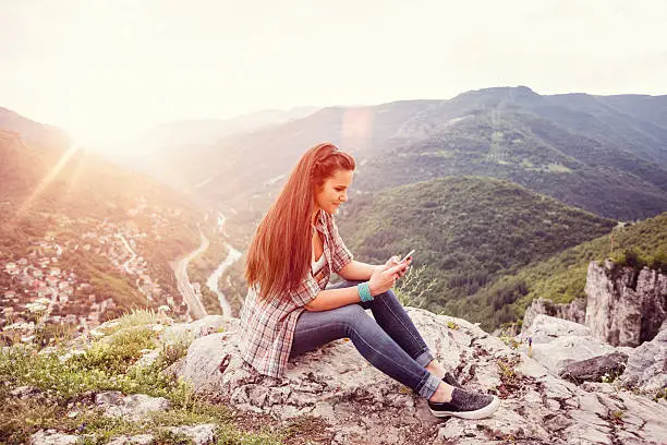 Photo of Teenage girl in the mountain