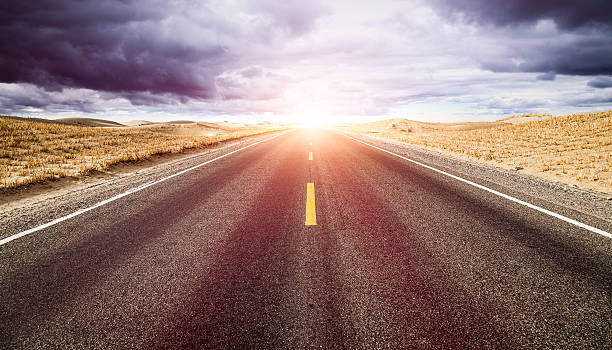 istock Under  clouds,  road to the distance. 588958342