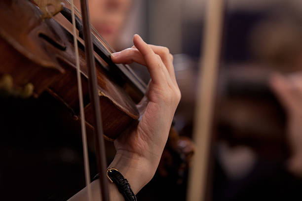 istock Hand girl playing the violin 588958922