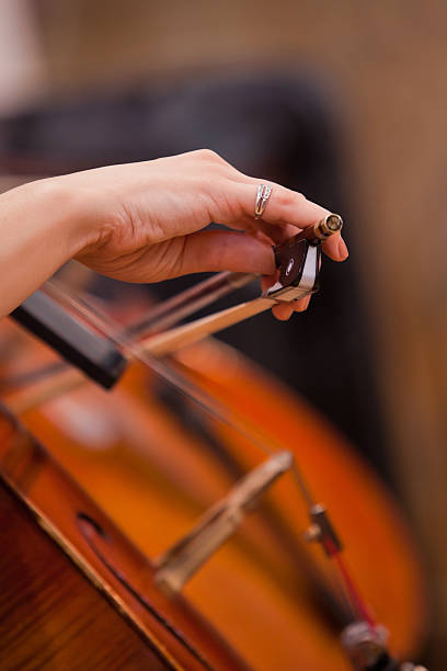 istock Hand girl playing cello 588959056