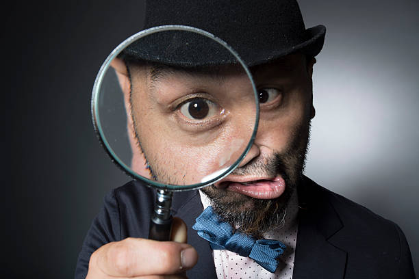 istock Men observing the eyeball in the magnifying glass 588960046