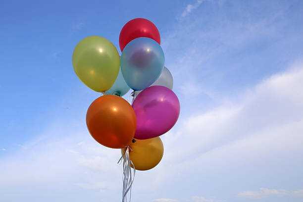 istock Balloons colorful on sky background 588960216