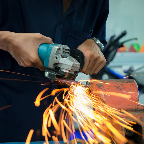 istock ndustrial Worker at the factory gringding 588960240