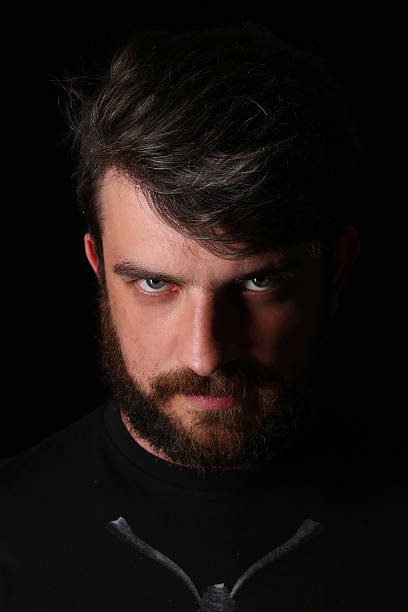 istock Bearded man looking into the camera. Close.up. Black 588960490