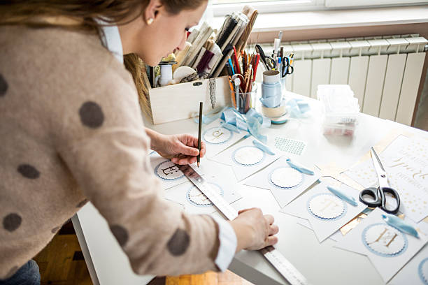 istock Artisan woman working with paper 588960776