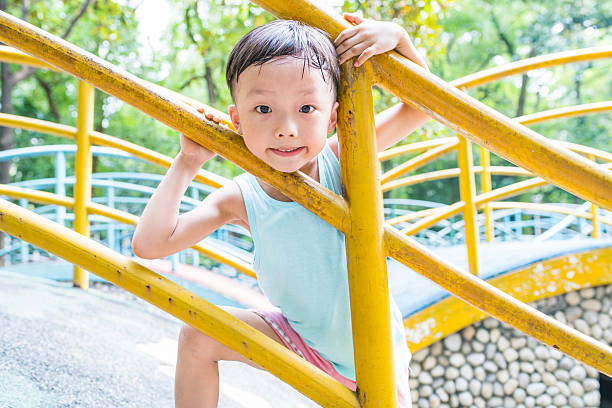 istock Cute children playing in the park 588964628