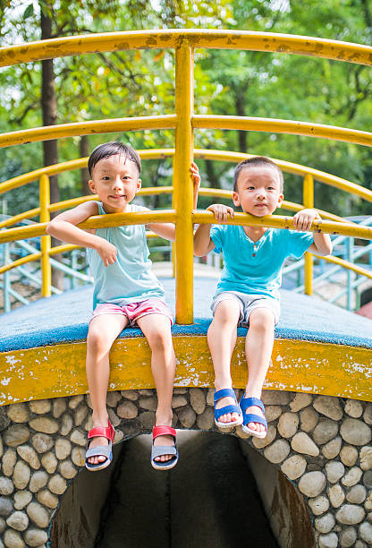 istock Cute children playing in the park 588964948