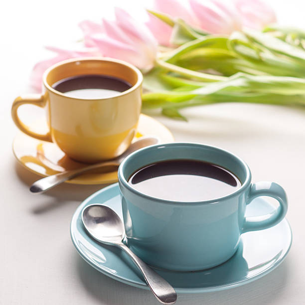 istock Blue and yellow cups of coffee 588965356