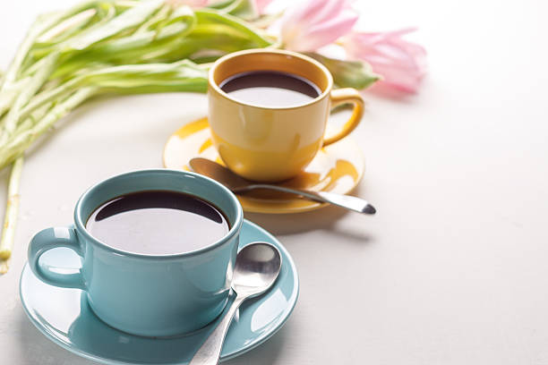 istock Blue and yellow cups of coffee 588965382