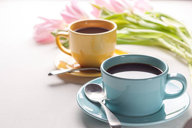 istock Blue and yellow cups of coffee 588965402