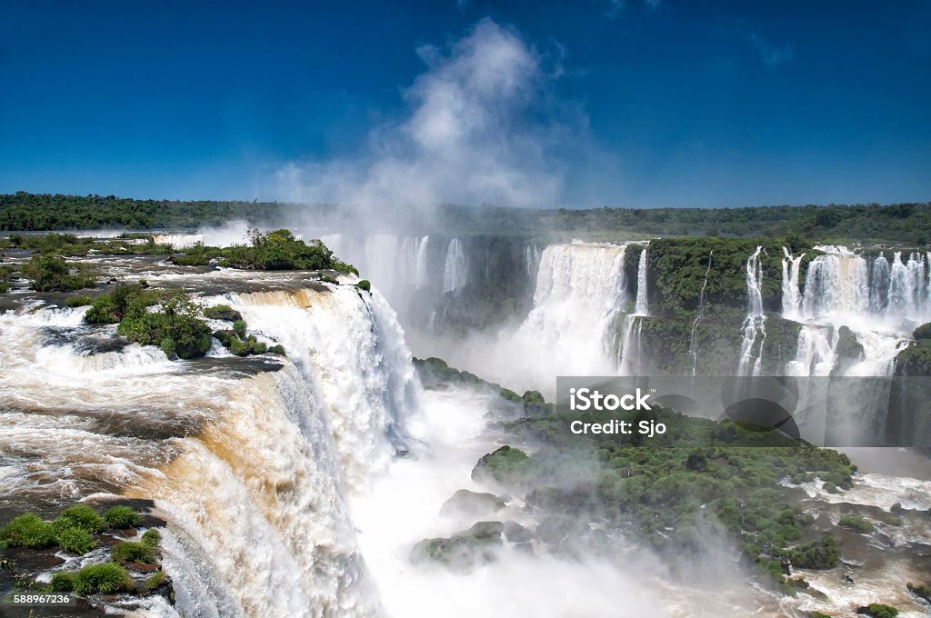 Beautiful Iguazu falls in the tropics of Brazil and Argentina Iguazu falls on the border between Brazil and Argentina. Iguazu falls are one of the New Seven Wonders of Nature and they are the largest waterfalls system in the world. Argentina Stock Photo