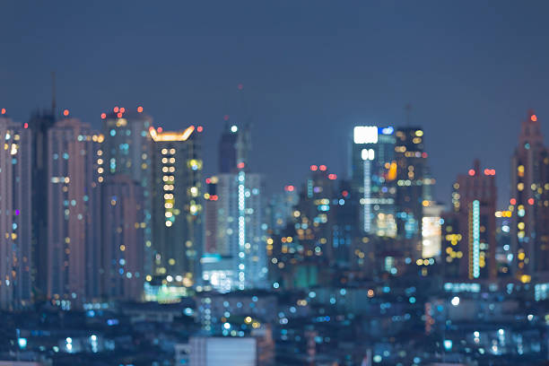 istock Blurred bokeh lights night view, city downtown, abstract background 588967752