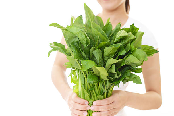 istock Woman holding vegetables 588969178