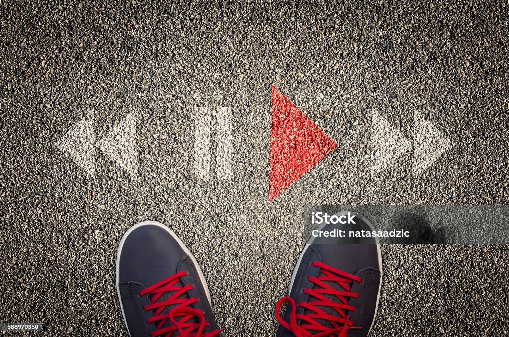 Play stop and rewind icons on asphalt On The Move Stock Photo