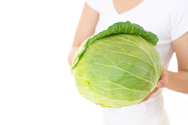 istock Woman holding vegetable 588971692