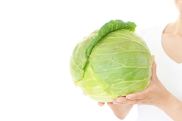 istock Woman holding vegetable 588971778
