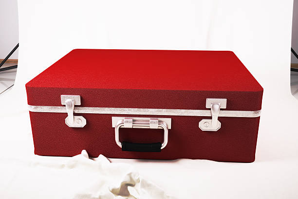 istock Red suitcase on the white canvas. 3d illustration 588973108