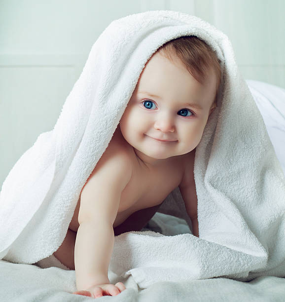 baby with a towel stock photo