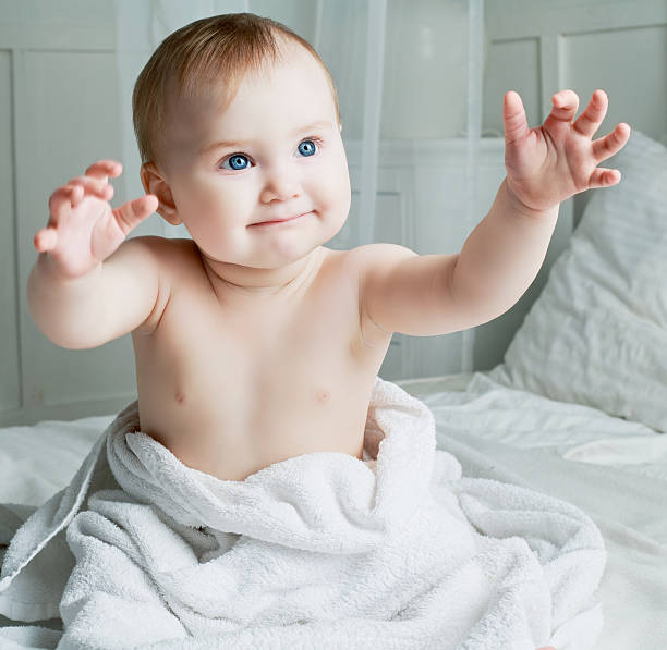 istock baby with a towel 588974374